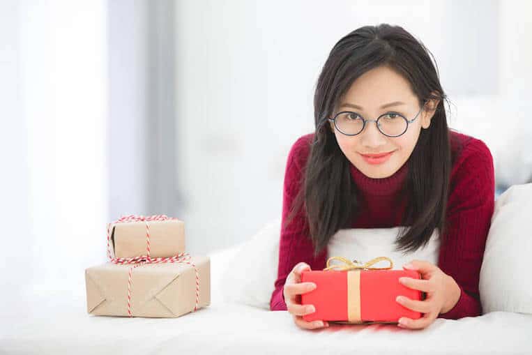 Cute South Korean girl with gift box